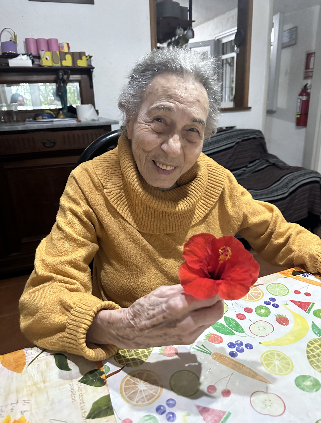Loretta Ross holding flower